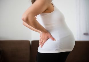 Почему болят почки при беременности